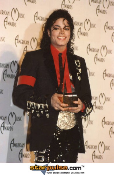 Michael Jackson with one of many awards in his career.